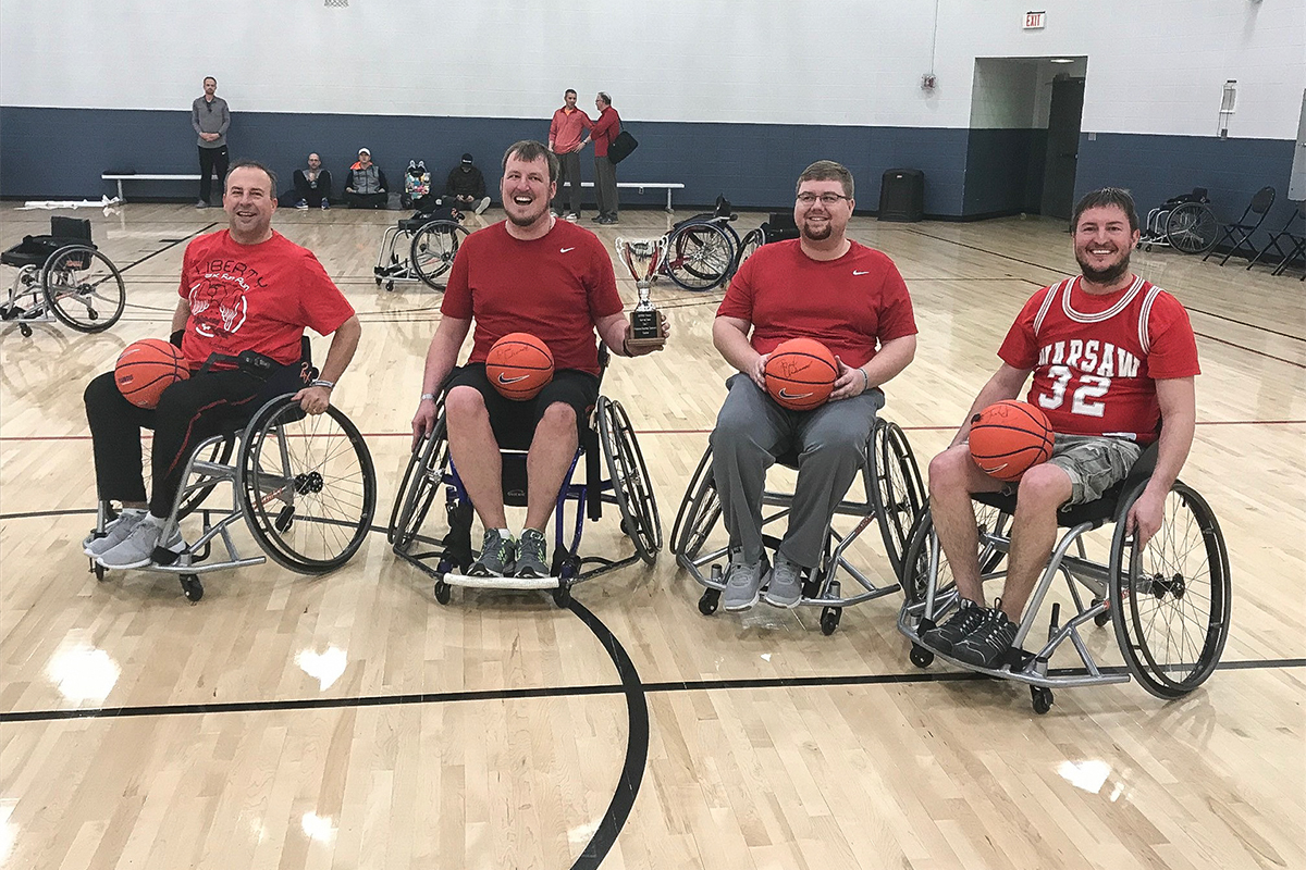 Four wheelchair basketball players